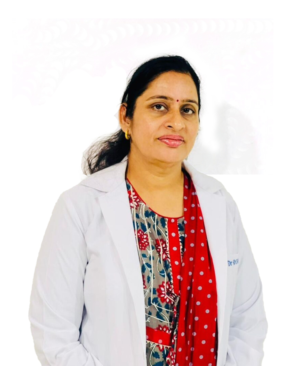 A woman in a white lab coat stands confidently in front of a vibrant, colorful background, representing her role as a retina specialist.