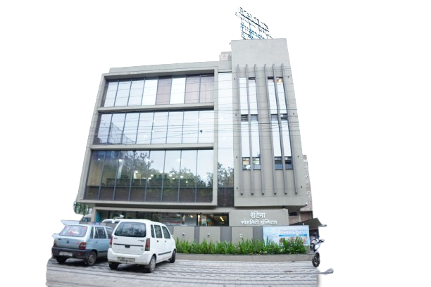 A modern building featuring a large glass window, with a parked car in front, associated with a retina specialist doctor.